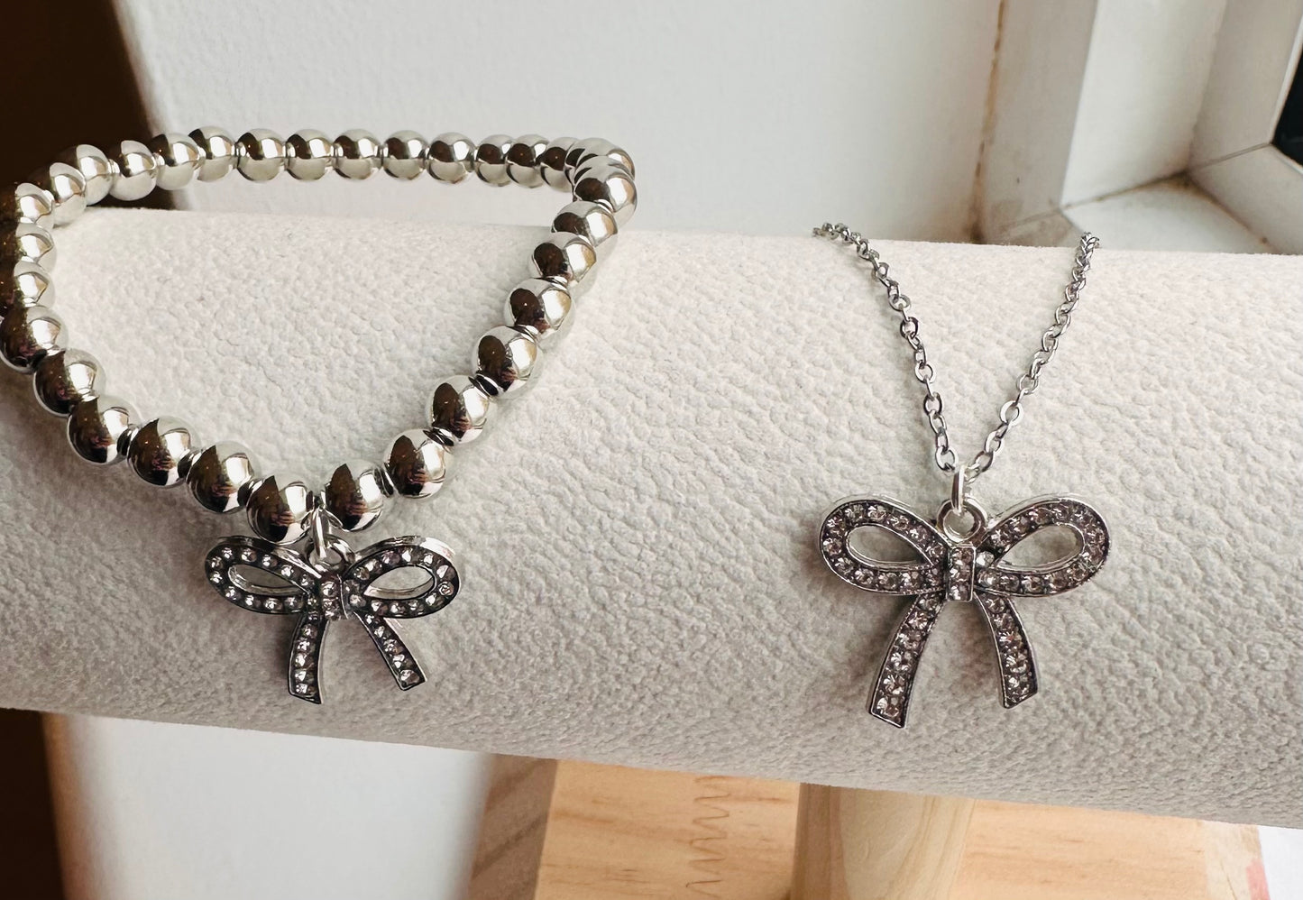 Silver bow charm duo