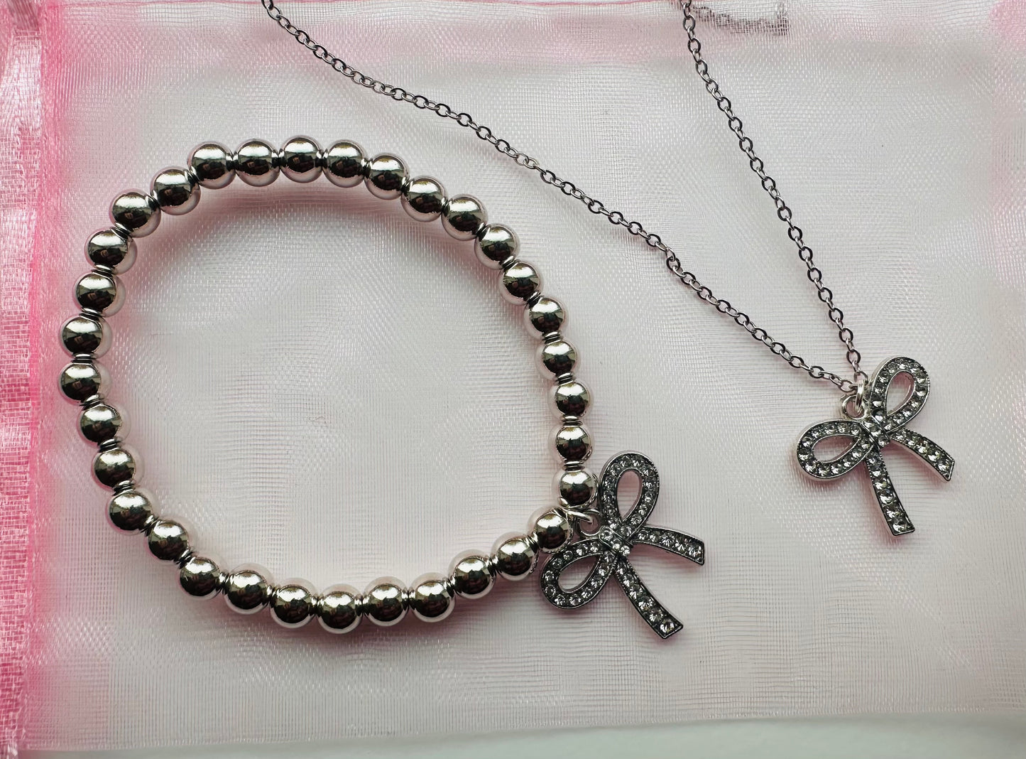 Silver bow charm duo
